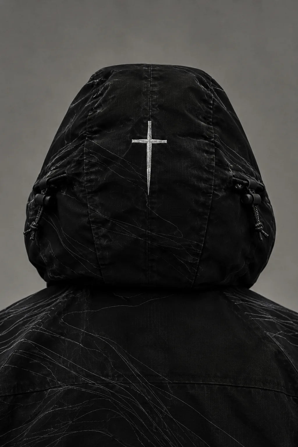 The hood from behind with a large reflective cross